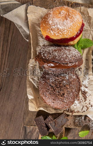 "Bolas de Berlim, or "Berlin Balls". Portuguese fried dough with sugar, Filled with chocolate or raspberry jam. Portuguese fried dough with sugar."
