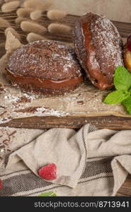 Bolas de Berlim, or chocolate Berlin Balls. Portuguese fried dough with sugar, Filled with chocolate.Pancakes Doughnuts Donuts stuffed with various creams