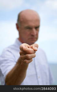 Bold man pointing at camera