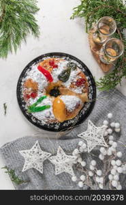 Bolo Rei or King&rsquo;s Cake is a traditional Xmas cake with fruits raisins nut and icing on kitcthen countertop. Is made for Christmas, Carnavale or Mardi Gras