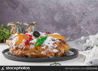 Bolo Rei or King&rsquo;s Cake is a traditional Xmas cake with fruits raisins nut and icing on kitcthen countertop. Is made for Christmas, Carnavale or Mardi Gras