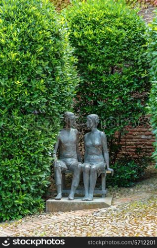BOLOGNA, ITALY - 27 JUNE, 2014: Statue young couple, Castle University.