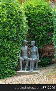 BOLOGNA, ITALY - 27 JUNE, 2014: Statue young couple, Castle University.