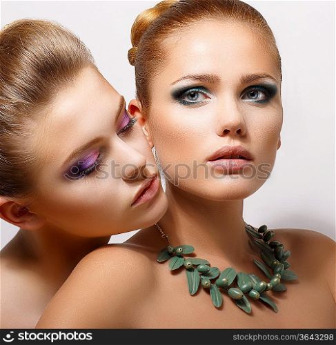 Bonding. Allure. Faces of Two Sensual Pretty Women Closeup. Aspiration