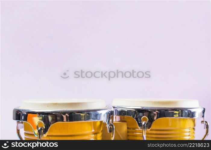 bongo drum pink background