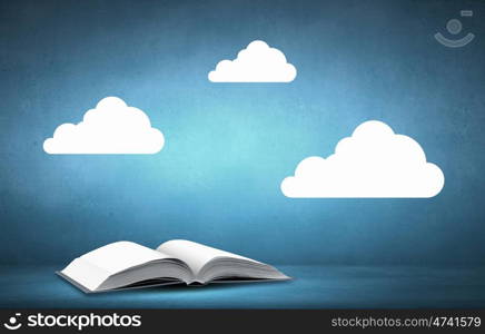 Book and clouds. Opened book with white clouds above pages
