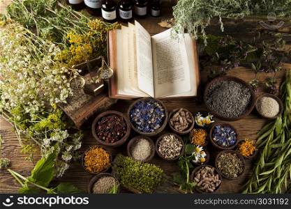 Book and Herbal medicine on wooden table background. Natural medicine on wooden table background