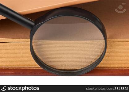 book and magnifying glass isolated on white background