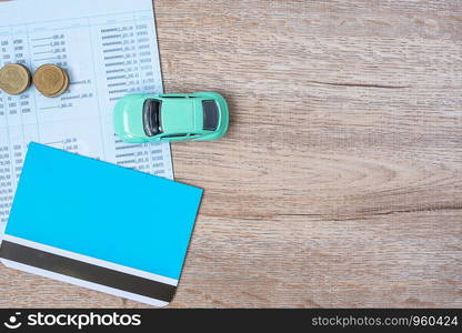 Book bank with Car on wood table background with copy space. financial, money, refinance, Car for cash and Car insurance concept