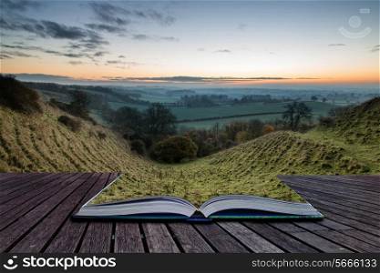 Book concept Beautiful countryside foggy sunrise landscape with layersof fog