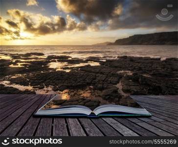 Book concept Stunning landscape ocean at sunset dramatic clouds