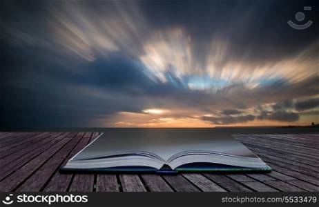 Book concept Stunning long exposure landscape image of snnset over sea