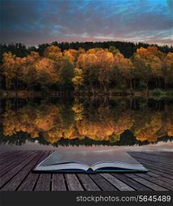 Book concept Stunning vibrant Autumn woodland reflected in still lake water landscape