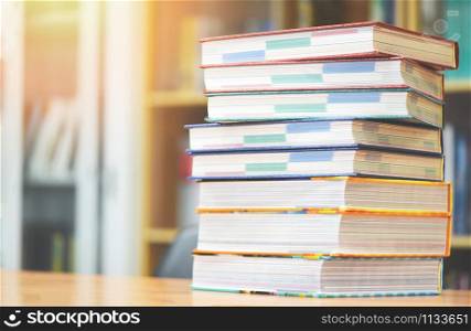 Book education concept back to school and study / stacked books in library on the table