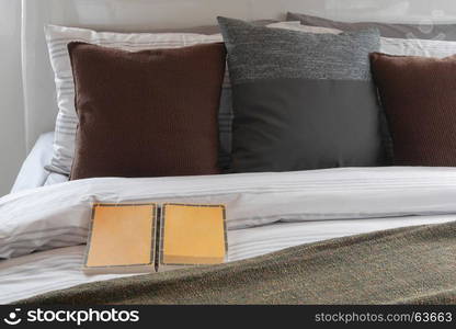 Book on the bed with classic color pillows