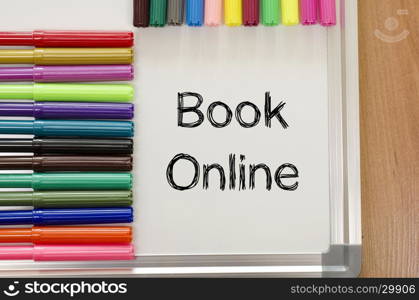 Book online text concept over whiteboard background