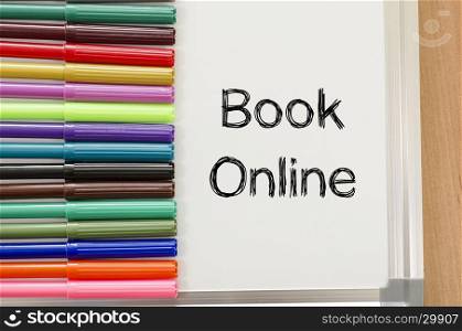 Book online text concept over whiteboard background