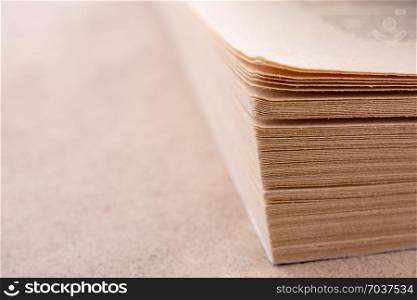Book pages partly in view on white background