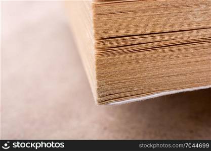 Book pages partly in view on white background