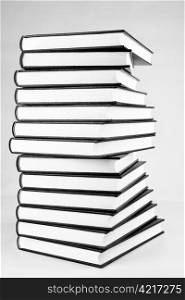 Book pile, black and white photo.
