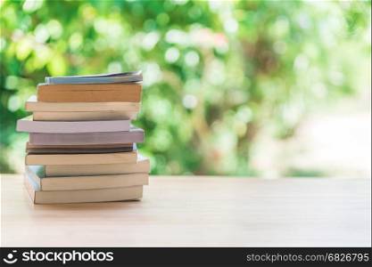 Book stack on wooden table
