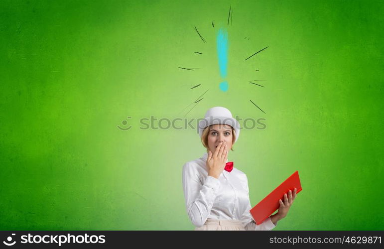 Book that blow up your imagination. Young woman in white hat with opened red book in hands