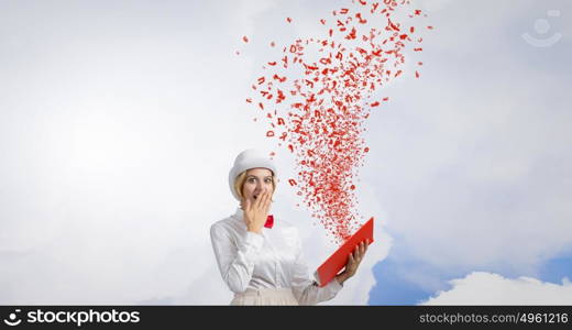 Book that blow up your imagination. Young woman in white hat with opened book in hands and characters flying out