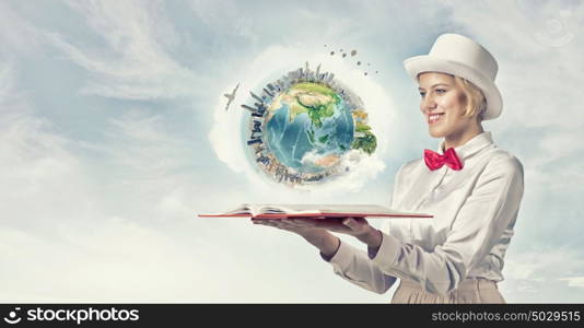 Book that develope your imagination. Young woman in white cylinder and red bowtie with book in hands. Elements of this image are furnished by NASA