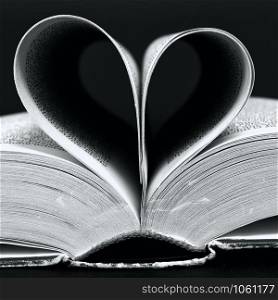 Book with pages folded into a heart shape