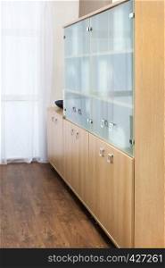 bookcase with glass doors in the office