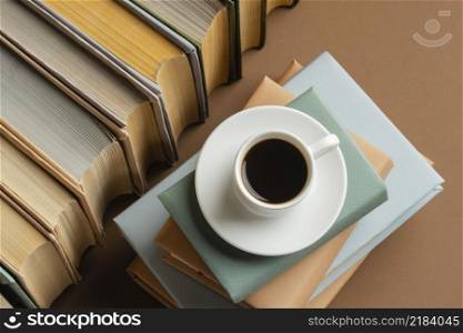 books arrangement with cup cofee