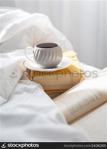 books bed with cup