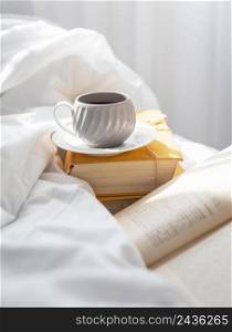 books bed with cup