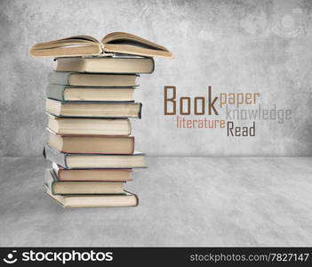 Books on old wall background. High quality.