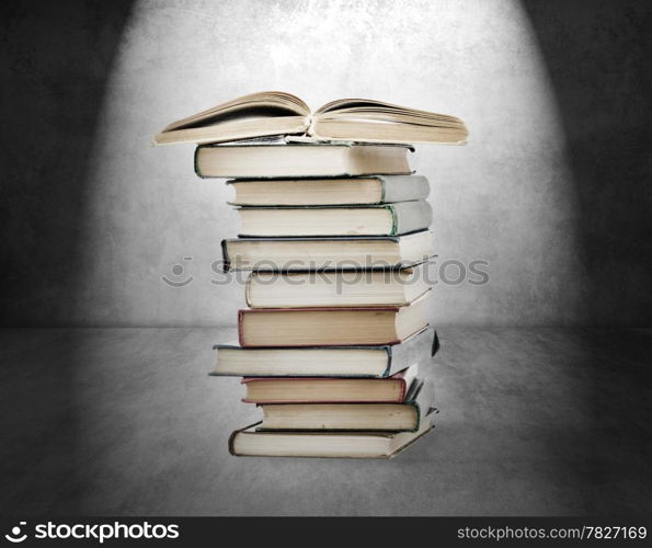 Books on old wall background. High quality.