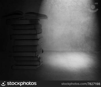 Books on old wall background. High quality.