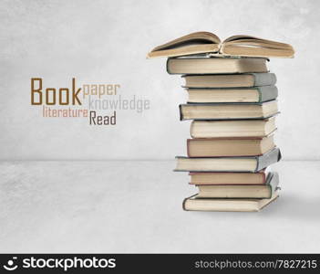 Books on old wall background. High quality.