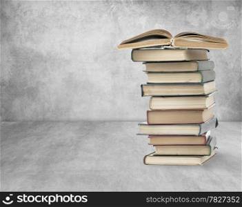 Books on old wall background. High quality.