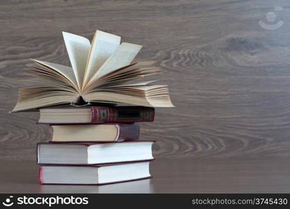 books on wooden deck tabletop