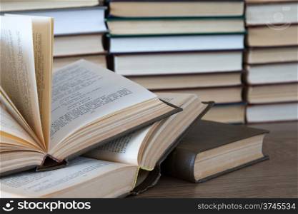 books on wooden deck tabletop
