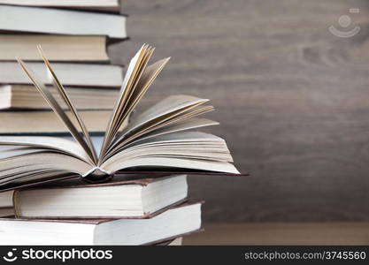 books on wooden deck tabletop