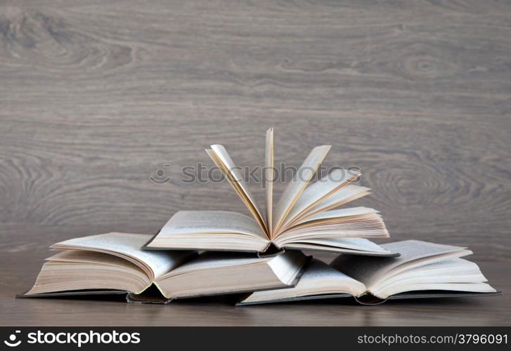 books on wooden deck tabletop