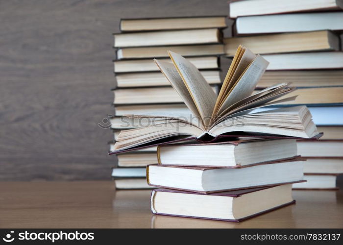 books on wooden deck tabletop