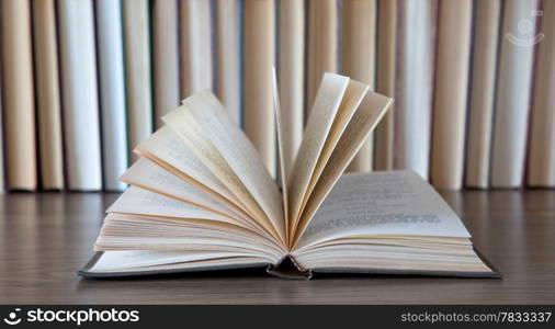 books on wooden deck tabletop