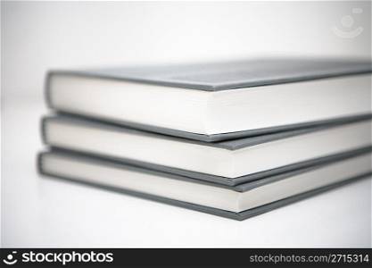 Books piled in abstract environment