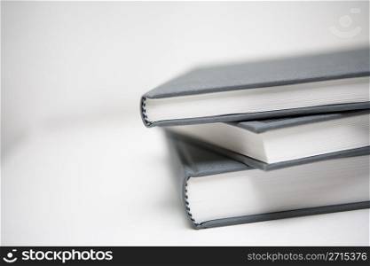 Books piled in abstract environment