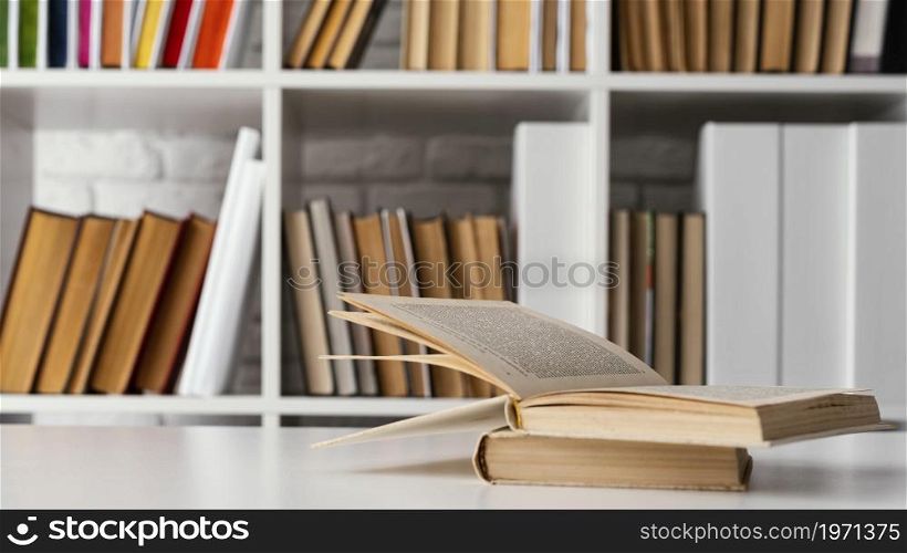 books shelf table arrangement. High resolution photo. books shelf table arrangement. High quality photo