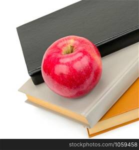 Books tower with apple isolated on white background.