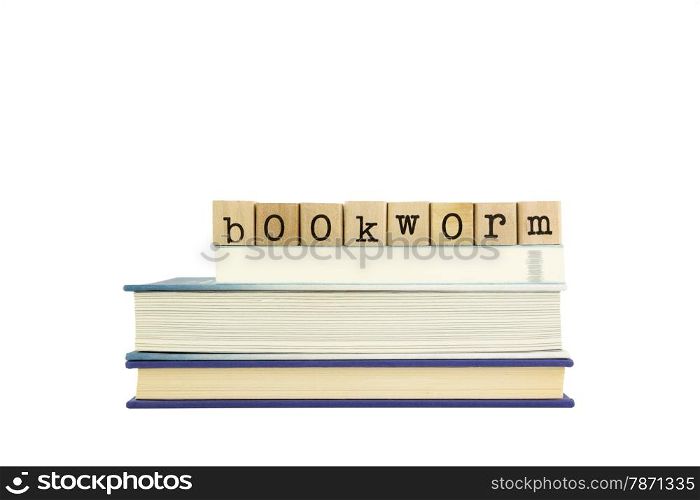 bookworm word on wood stamps stack on books, leisure and bookshop concept