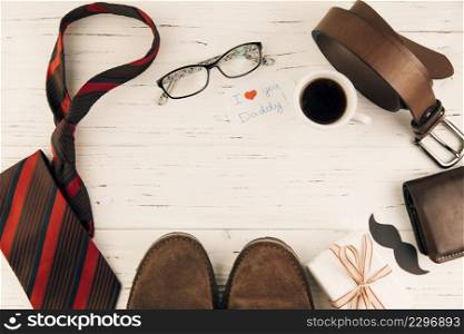 boots among male accessories near gift cup drink